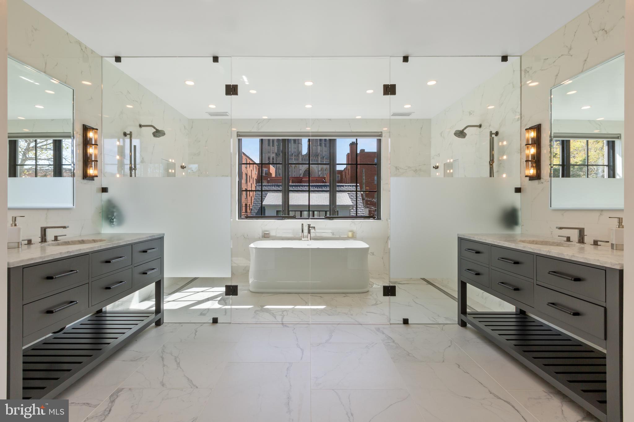 3119 38th Street Northwest Washington, DC 20016 - Photo 10 of 20 a bathroom with a tub sink double vanity and mirror