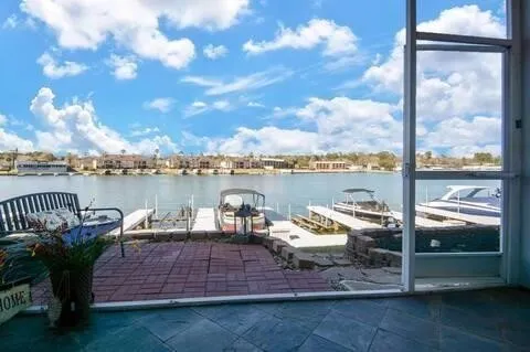 a view of a roof deck with couches and a table