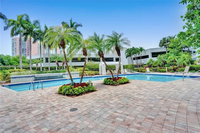 a view of a park with palm trees