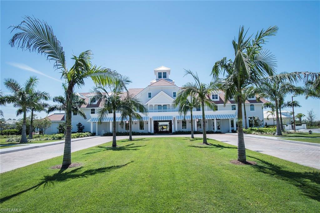 8829 Paradera Court Naples, FL 34112 - Photo 26 of 31 a building with palm trees in front of it