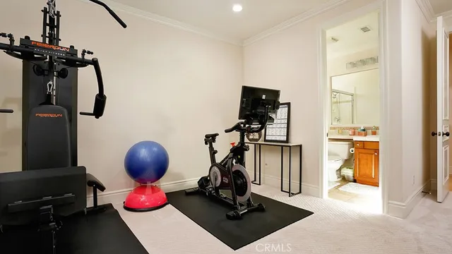 an aerial view of a house with a yard and potted plants