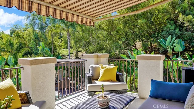a view of a dining room with furniture and windows