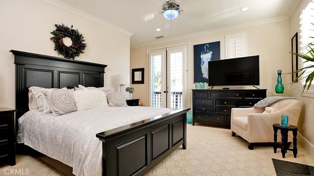 a view of a patio with table and chairs under an umbrella