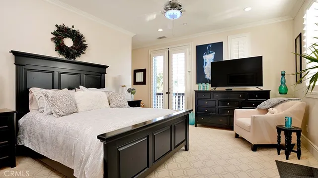 a view of a patio with table and chairs under an umbrella