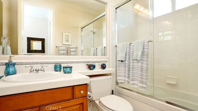 a view of a patio with couches table and chairs and potted plants