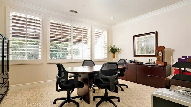 a view of a chairs and table in the patio