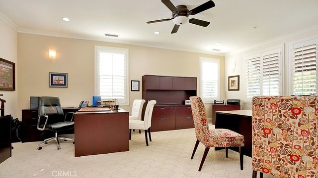 a view of a patio with table and chairs potted plants