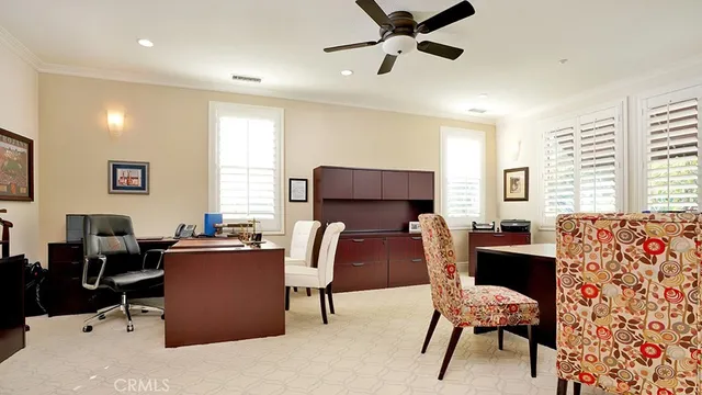 a view of a patio with table and chairs potted plants