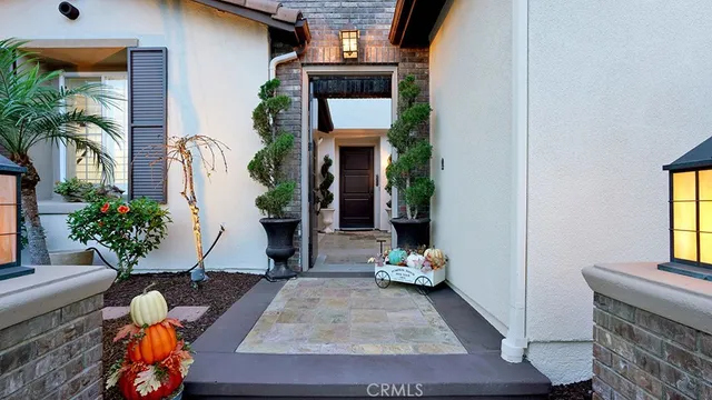 a view of a house with a patio and a yard