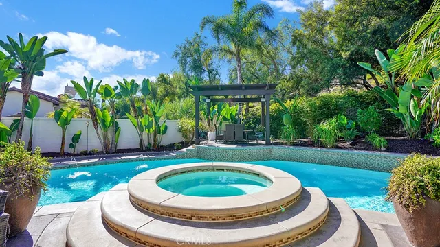 a view of a patio with swimming pool table and chairs