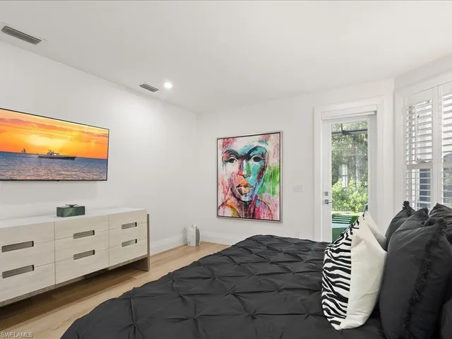 a bedroom with furniture and a window