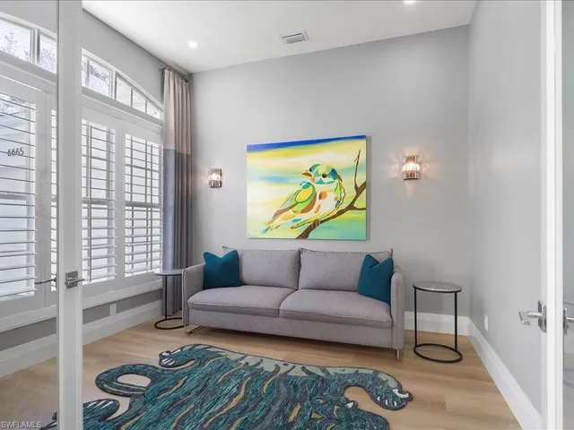 a living room with furniture and a window