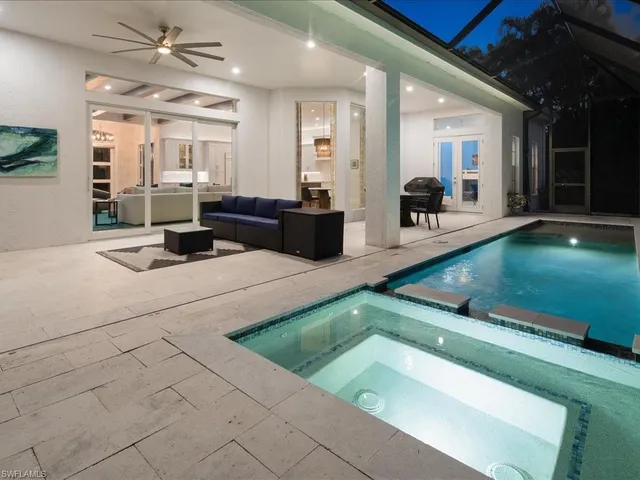 a kitchen with stainless steel appliances granite countertop a sink and a counter top space