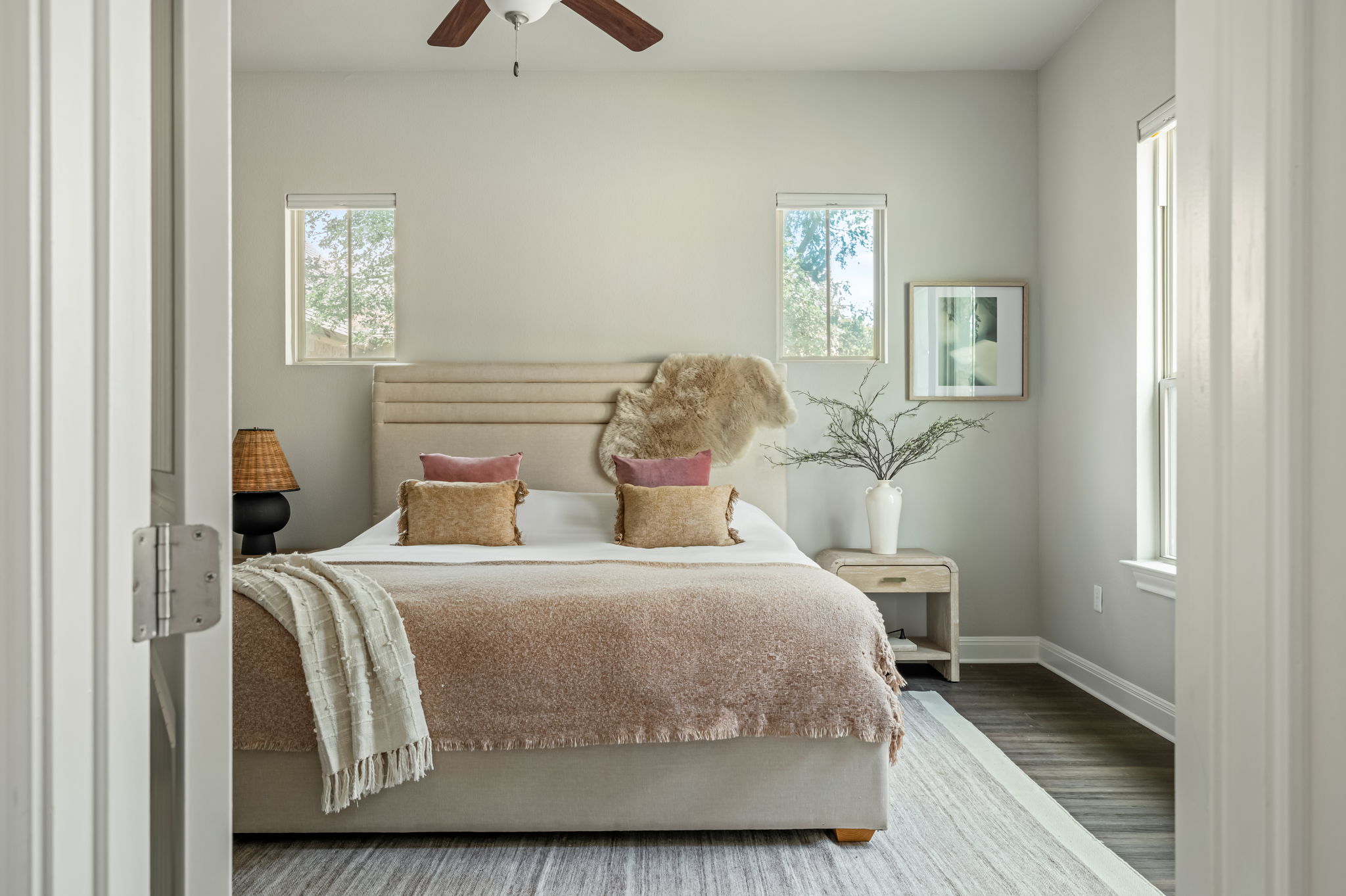 2516 Hopsack Mills Road Austin, TX 78748 - Photo 16 of 39 Bedroom featuring dark wood-finish flooring, light grey painted walls, and a ceiling fan with wood-finish blades