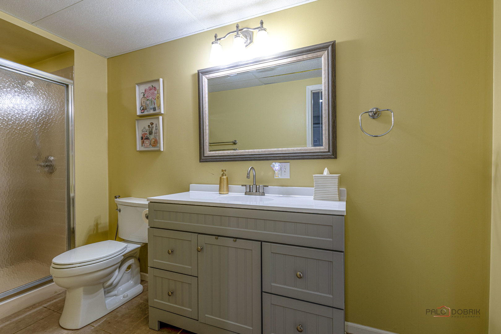 2627 Rutland Road Naperville, IL 60564 - Photo 27 of 38 a bathroom with a granite countertop toilet sink and mirror