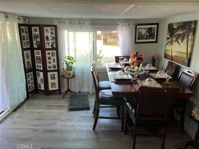a view of a dining room with furniture and window