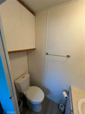 a bedroom with a bed and a mirror