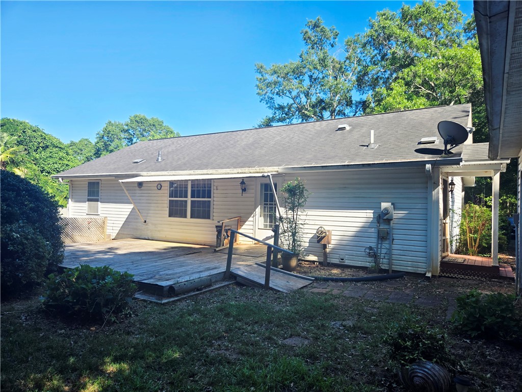 202 Keith Lane Seneca, SC 29678 - Photo 21 of 23 A spacious wooden deck extends from the rear of this charming residence, perfect for outdoor enjoyment.