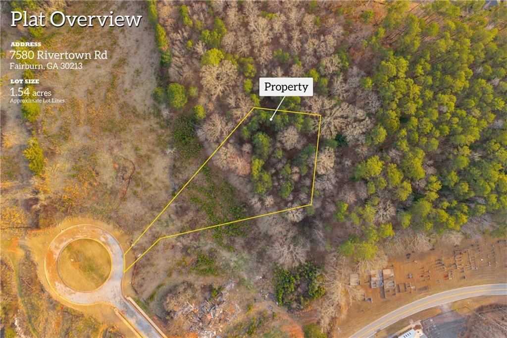 7580 Rivertown Road Fairburn, GA 30213 - Photo 3 of 17 a sign that is on a brick wall