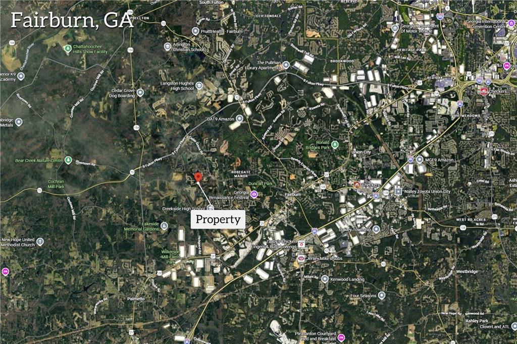 7580 Rivertown Road Fairburn, GA 30213 - Photo 4 of 17 a sign that is on a tree