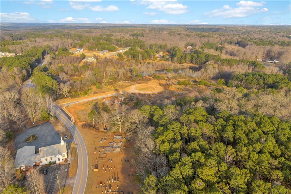 7580 Rivertown Road Fairburn, GA 30213 - Photo 5 of 17 an aerial view of residential houses with outdoor space