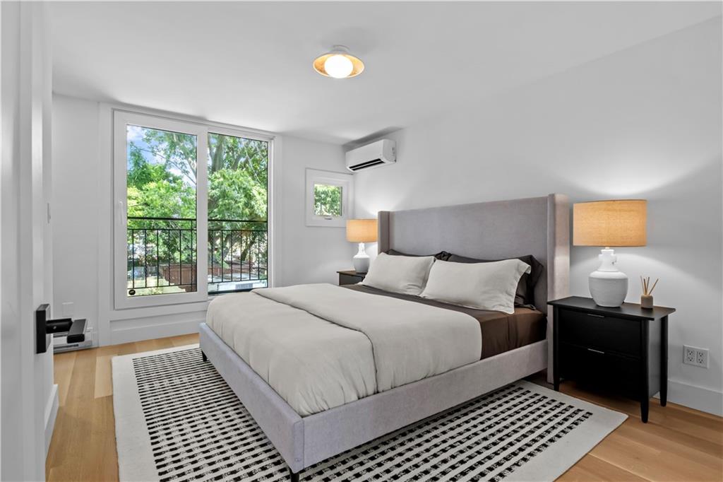401 18th Street Brooklyn, NY 11215 - Photo 11 of 17 a bedroom with a bed and a window