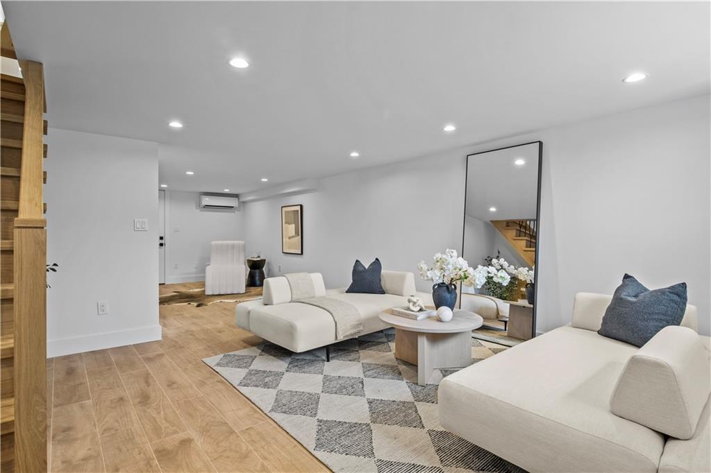 401 18th Street Brooklyn, NY 11215 - Photo 13 of 17 a living room with furniture and a wooden floor