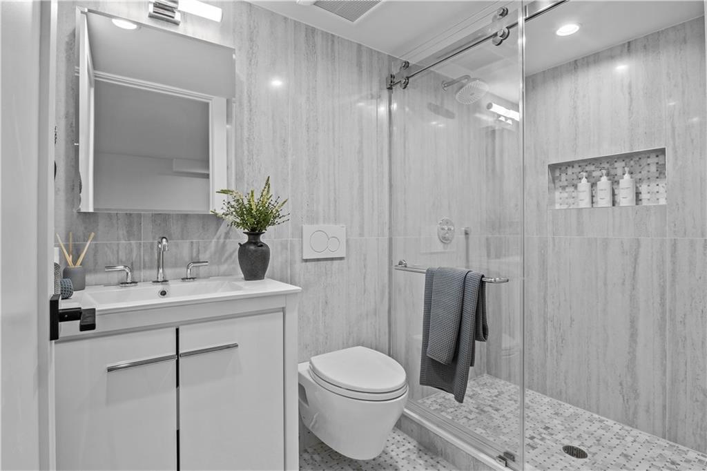 401 18th Street Brooklyn, NY 11215 - Photo 14 of 17 a bathroom with a toilet sink and shower