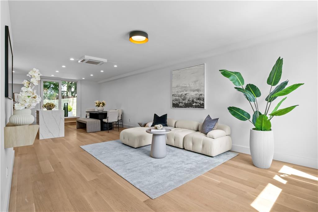 401 18th Street Brooklyn, NY 11215 - Photo 2 of 17 a living room with furniture and a potted plant