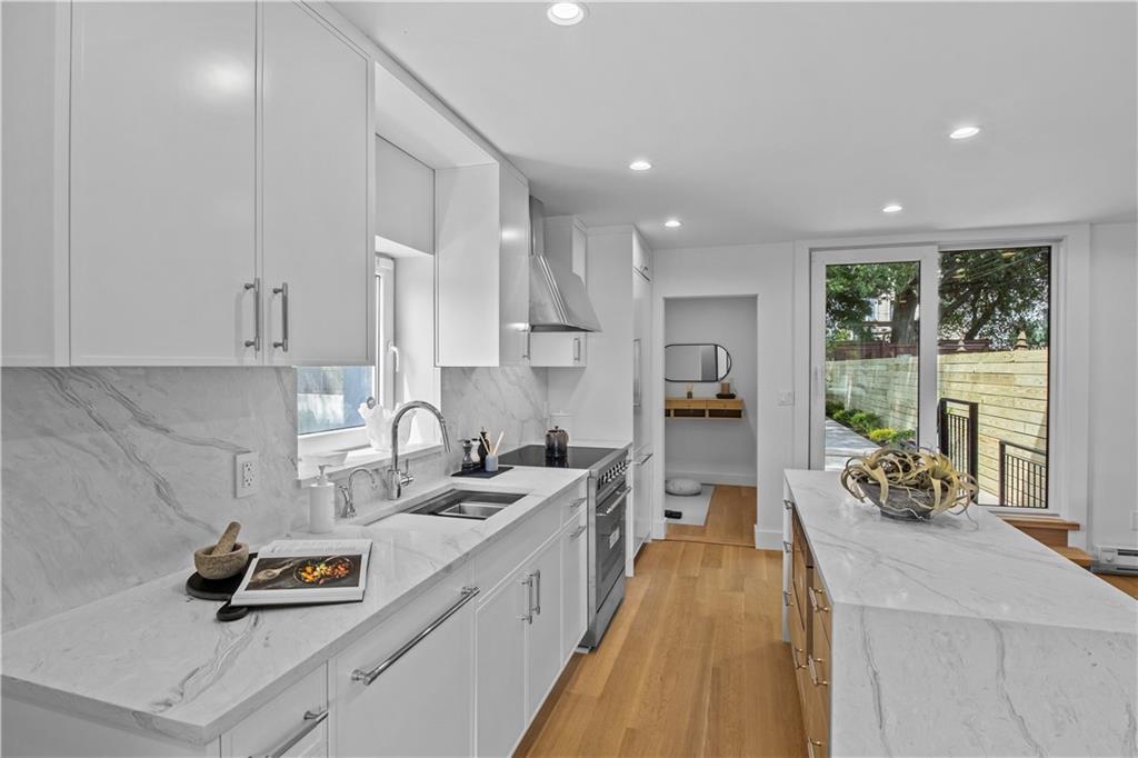 401 18th Street Brooklyn, NY 11215 - Photo 4 of 17 a kitchen with sink refrigerator and window