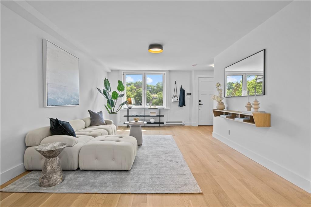 401 18th Street Brooklyn, NY 11215 - Photo 5 of 17 a living room with furniture and a large window