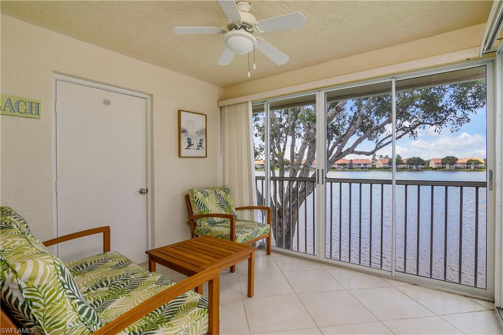 7754 Emerald Circle, Unit T202 Naples, FL 34109 - Photo 5 of 22 a bedroom with furniture and a window