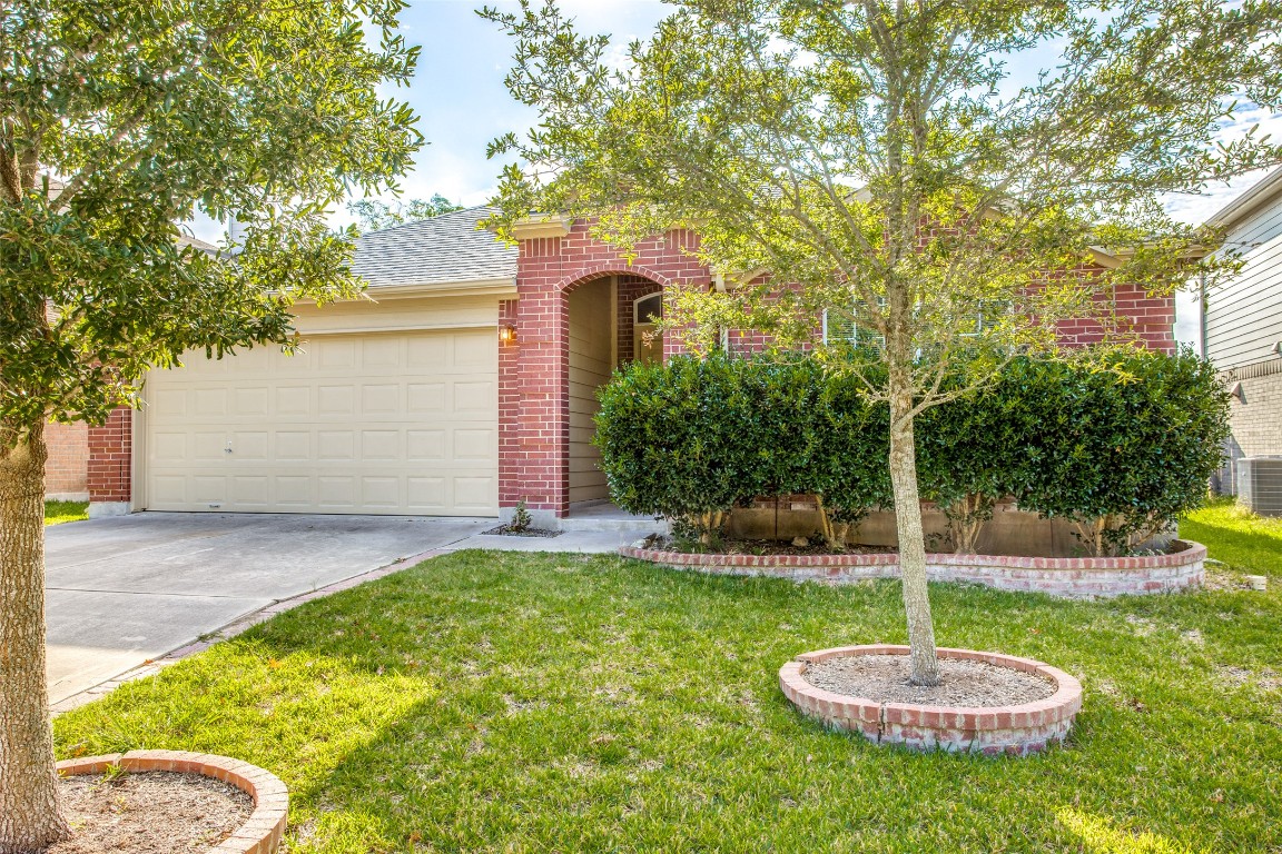 Undisclosed Address Round Rock, TX 78665 - Photo 2 of 25 a backyard of a house with a fountain table and chairs