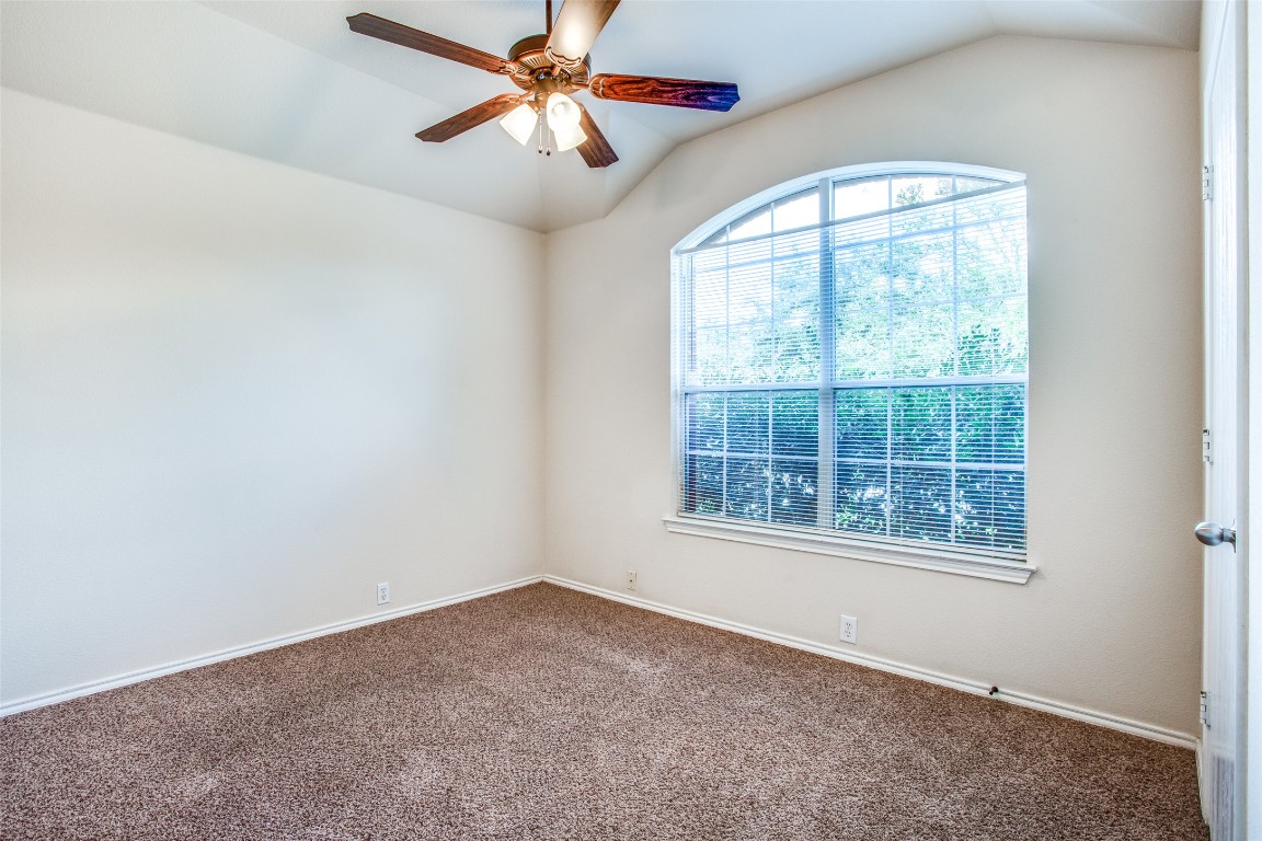 Undisclosed Address Round Rock, TX 78665 - Photo 6 of 25 an empty room with a window and a fan