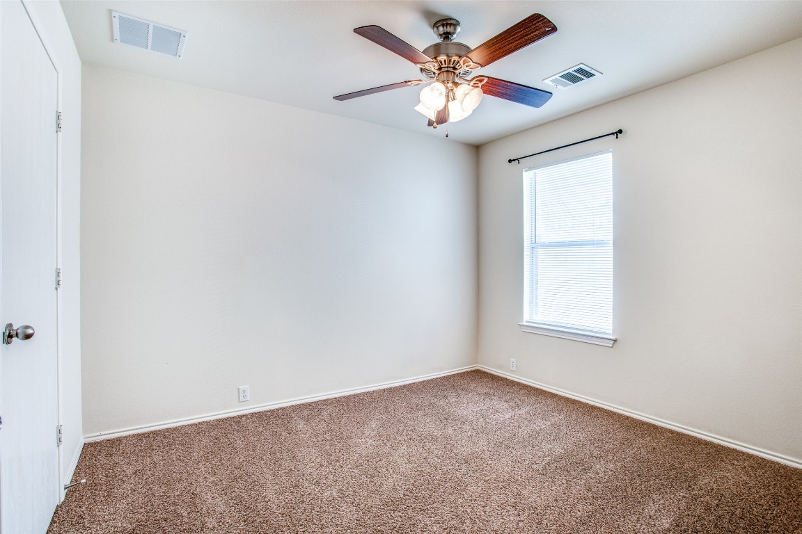 Undisclosed Address Round Rock, TX 78665 - Photo 7 of 25 an empty room with a window and a fan