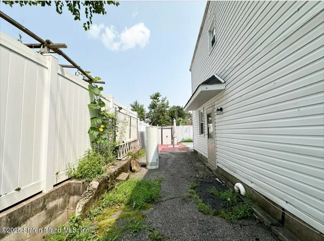 a view of a house with a small yard