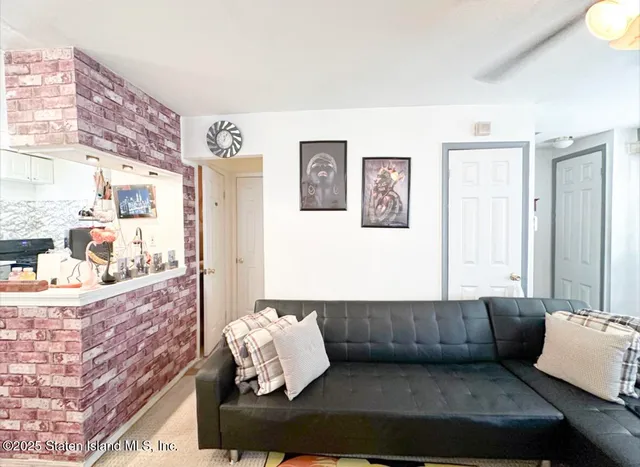 a dining room with furniture and a chandelier