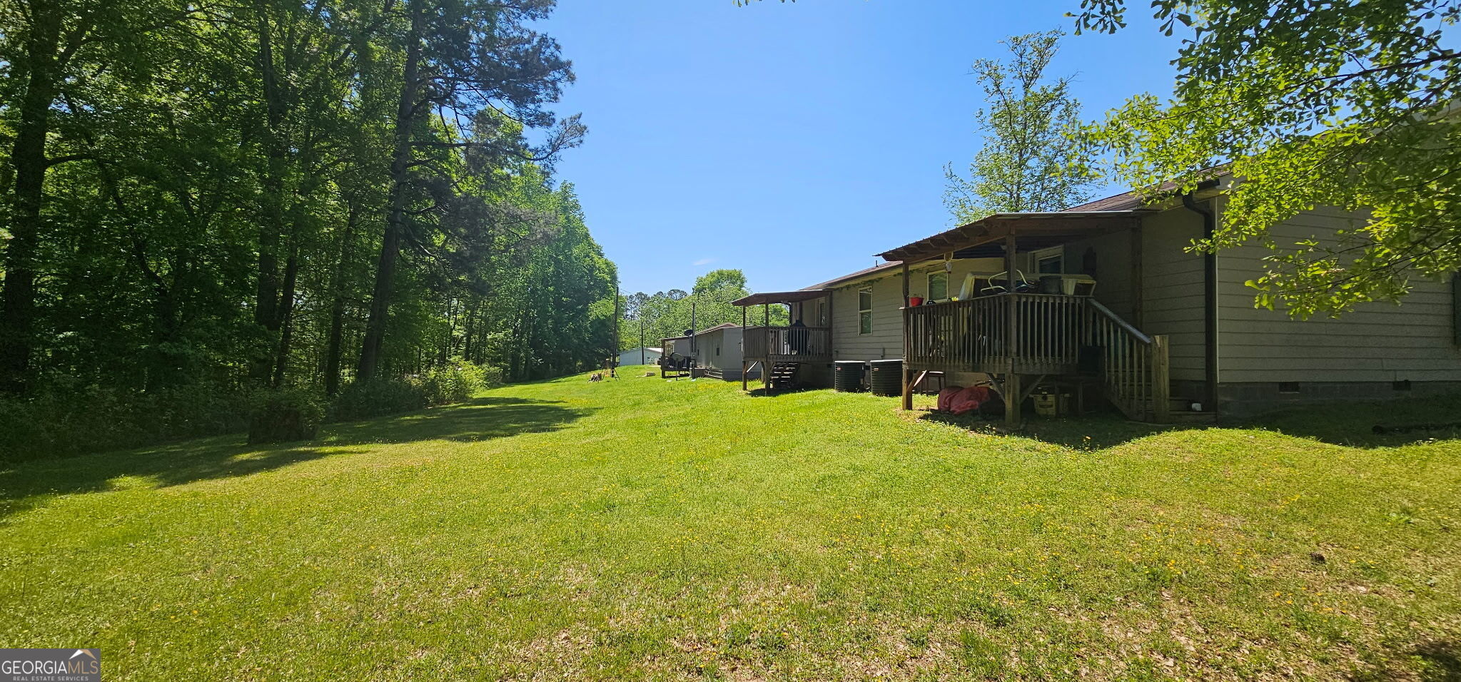 234 Temple Terrace Temple, GA 30179 - Photo 17 of 17 a view of a house with backyard and tree