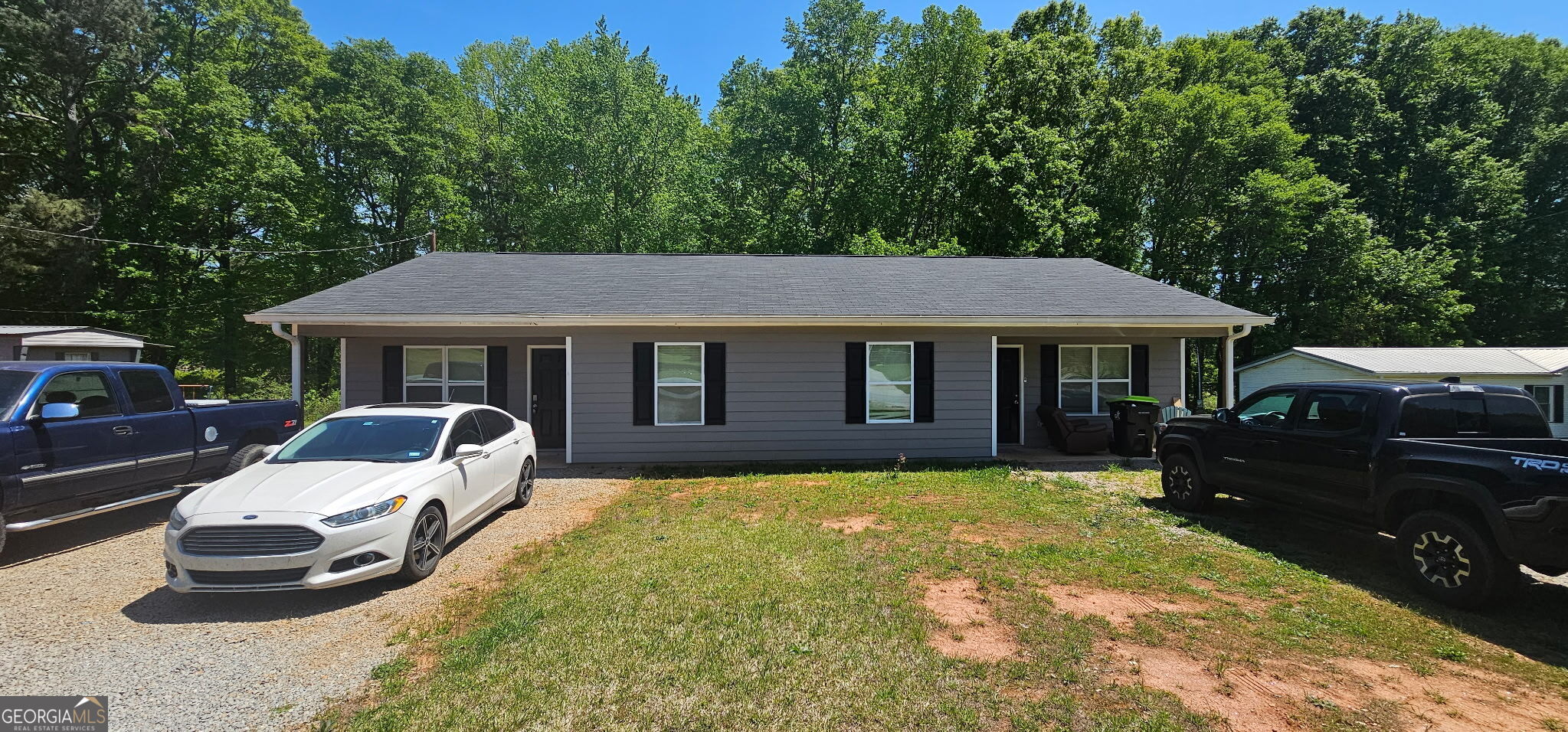 234 Temple Terrace Temple, GA 30179 - Photo 4 of 17 a front view of a house with a garden and porch