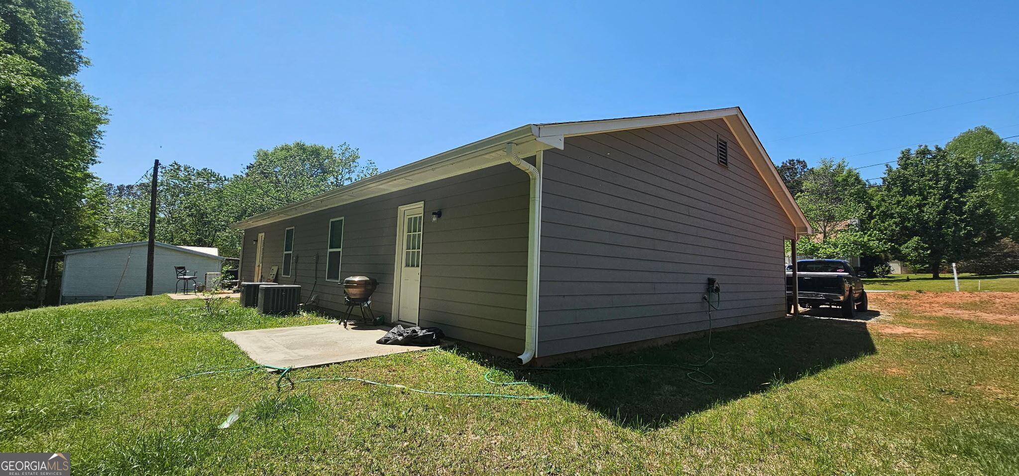 234 Temple Terrace Temple, GA 30179 - Photo 6 of 17 a backyard of a house with table and chairs