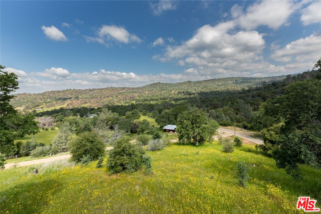 4132 Usona Road Mariposa, CA 95338 - Photo 20 of 26 a view of a lake with mountains in the background