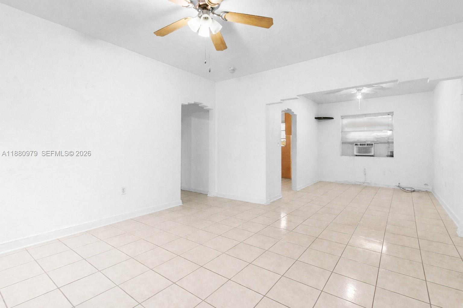 1345 Southwest 7th Street Miami, FL 33135 - Photo 10 of 37 an empty room with fan and windows