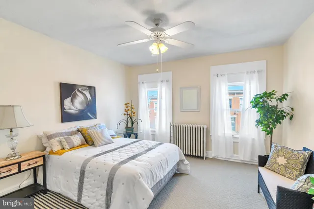 a bedroom with bed and window