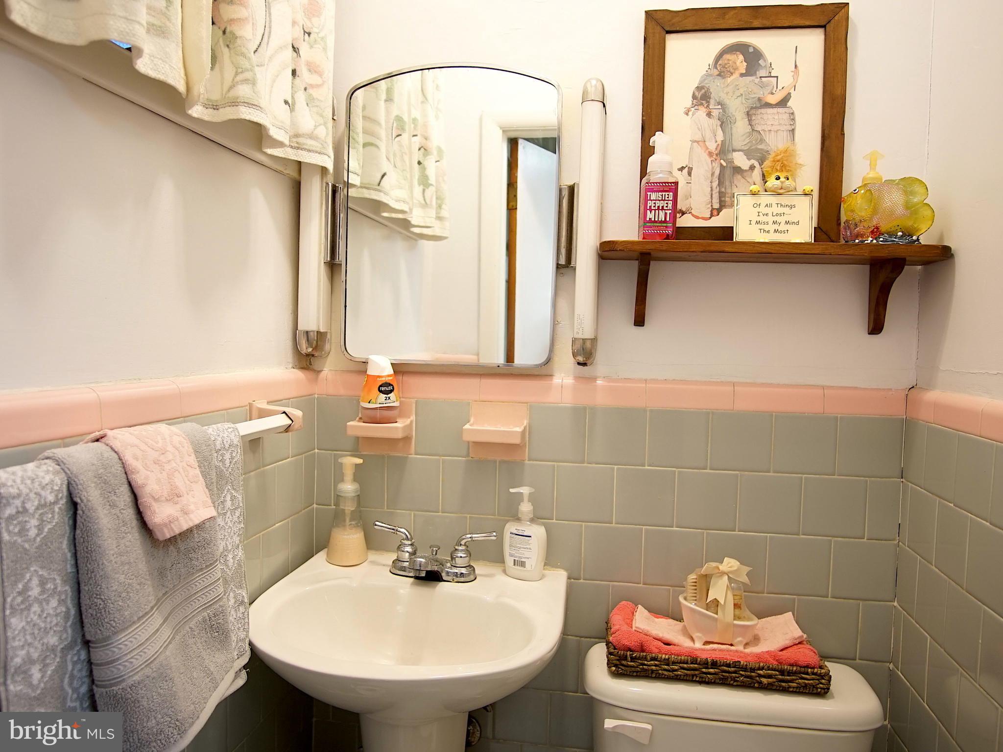 25 Cedarhill Road Randallstown, MD 21133 - Photo 22 of 37 Powder room just off sunken/family rm