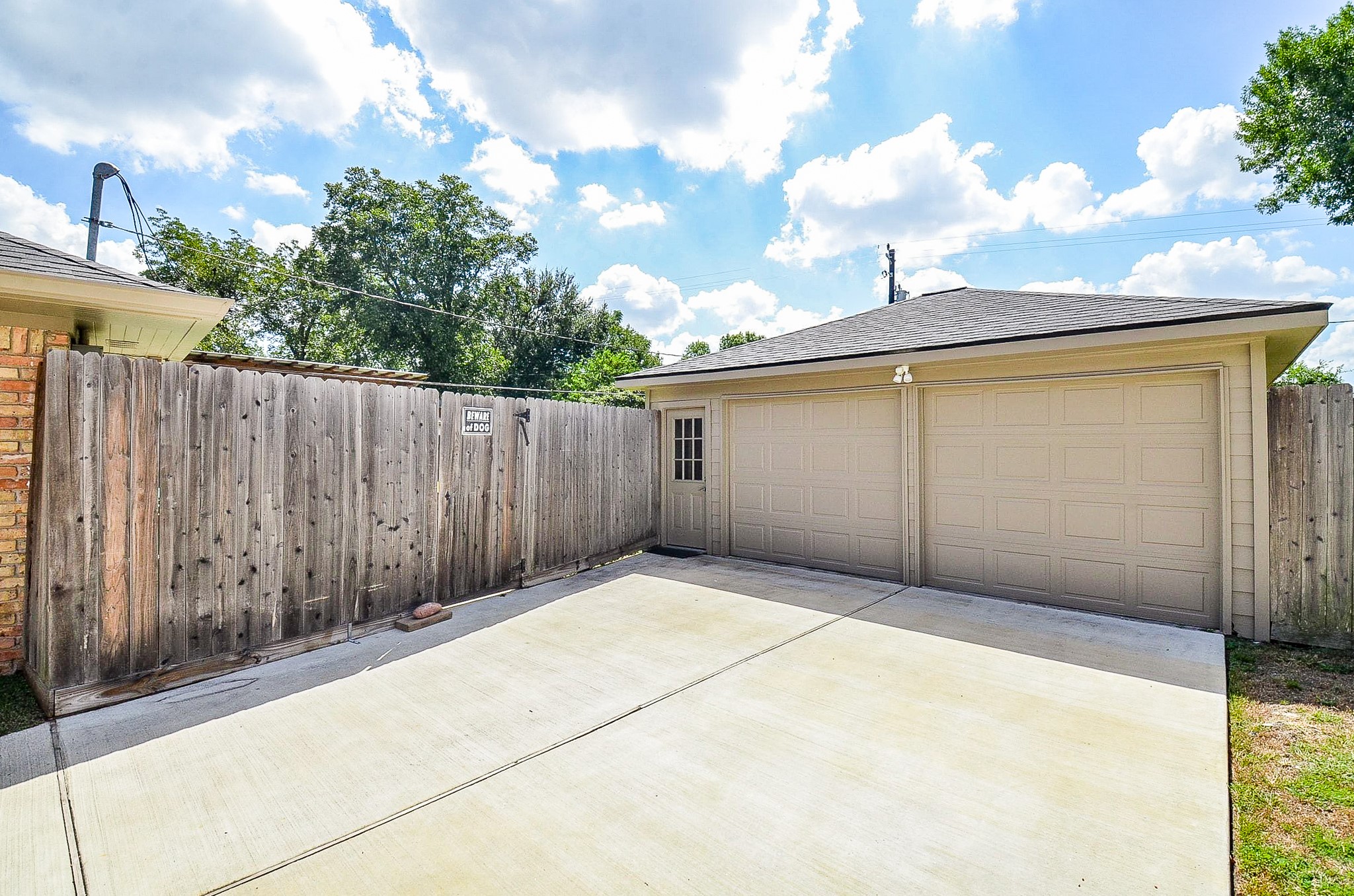 5127 Hummingbird Street Houston, TX 77035 - Photo 26 of 34 There is a long driveway with a two-car garage.