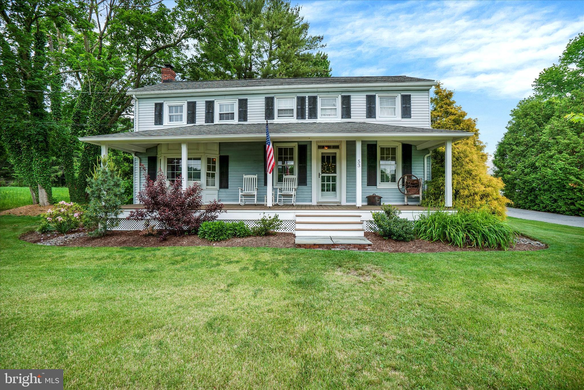 53 Main Street Oley, PA 19547 - Photo 1 of 26 a front view of a house with a garden