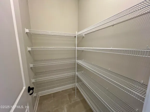 a view of an empty walk in closet