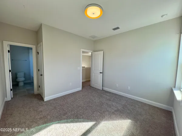 a view of an empty room and window