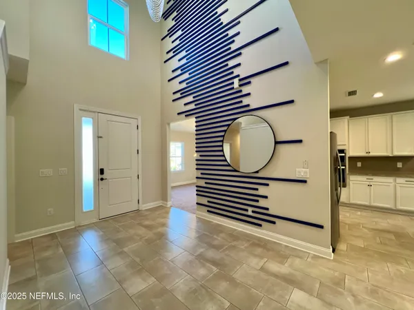 a view of a hallway with washer and dryer