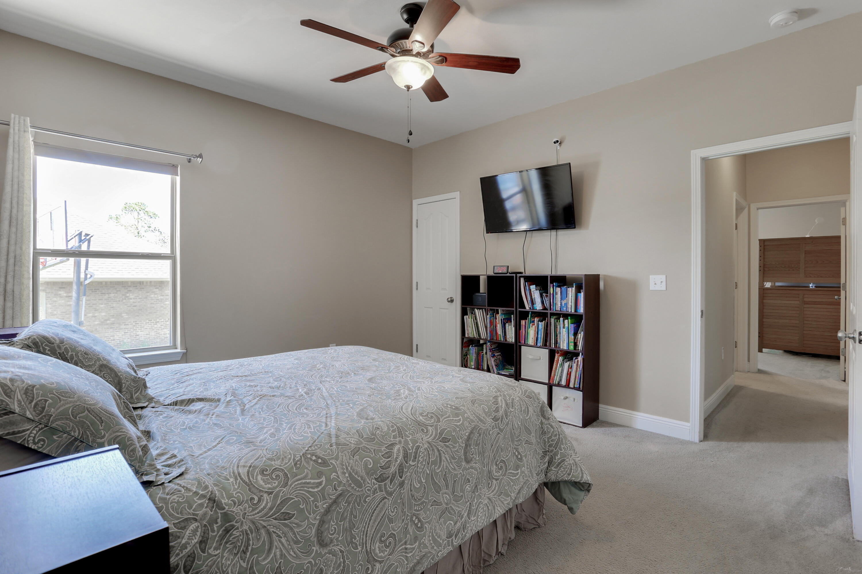 610 Red Fern Road Crestview, FL 32536 - Photo 54 of 68 a bedroom with a large bed and a window